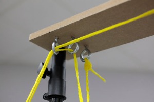 A close-up of the top of the pulley system, where Ling rigged a board atop two tripods